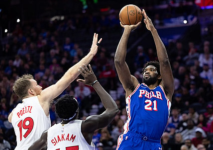 Nov 2, 2023; Philadelphia, Pennsylvania, USA; Philadelphia 76ers center Joel Embiid (21) shoots the ball past Toronto Raptors center Jakob Poeltl (19) and forward Pascal Siakam (43) during the second quarter at Wells Fargo Center. Mandatory Credit: Bill Streicher-USA TODAY Sports