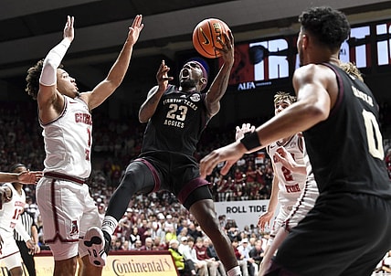 Feb 17, 2024; Tuscaloosa, Alabama, USA;  Texas A&M Aggies guard Tyrece Radford (23) shoots in the lane against Alabama Crimson Tide guard Mark Sears (1) during the first half at Coleman Coliseum. Mandatory Credit: Gary Cosby Jr.-USA TODAY Sports
