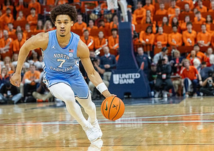 Feb 24, 2024, in Charlottesville, Virginia, USA; North Carolina Tar Heels guard Seth Trimble (7) dribbles against the Virginia Cavaliers at John Paul Jones Arena. Mandatory Credit: Hannah Pajewski-USA TODAY Sports