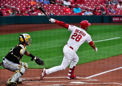 May 18, 2021; St. Louis, Missouri, USA;  St. Louis Cardinals third baseman Nolan Arenado (28) hits a two run home run during the first inning against the Pittsburgh Pirates at Busch Stadium. Mandatory Credit: Jeff Curry-USA TODAY Sports