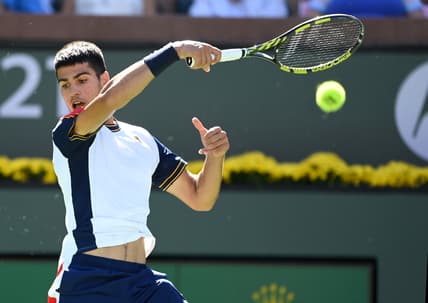 Oct 10, 2021; Indian Wells, CA, USA; Carlos Alcaraz (ESP) hits a shot during in his second round match against Andy Murray (GBR) in the BNP Paribas Open at the Indian Wells Tennis Garden. Mandatory Credit: Jayne Kamin-Oncea-USA TODAY Sports