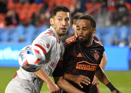 Oct 16, 2021; Toronto, Ontario, CAN;   Toronto FC defender Omar Gonzalez (44) watches his saved header bounce away from Atlanta United defender Anton Walkes (4) in the second half at BMO Field. Mandatory Credit: Dan Hamilton-USA TODAY Sports
