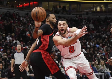 Jan 30, 2022; Chicago, Illinois, USA;  Chicago Bulls guard Zach LaVine (8) drives to the basket against Portland Trail Blazers forward Norman Powell (24), left, during the first half at the United Center. Mandatory Credit: Matt Marton-USA TODAY Sports