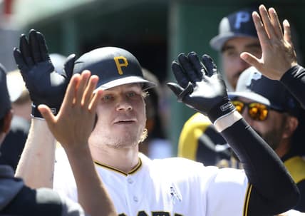 Jun 19, 2022; Pittsburgh, Pennsylvania, USA; Pittsburgh Pirates left fielder Jack Suwinski (65) celebrates his second solo home run of the game in the dugout against the San Francisco Giants during the sixth inning at PNC Park. Mandatory Credit: Charles LeClaire-USA TODAY Sports