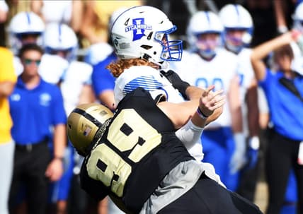 Sep 10, 2022; West Lafayette, Indiana, USA;  Indiana State Sycamores quarterback Gavin Screws (10) is sacked by Purdue Boilermakers defensive end Jack Sullivan (99) during the first quarter against the Purdue Boilermakers at Ross-Ade Stadium. Mandatory Credit: Robert Goddin-USA TODAY Sports