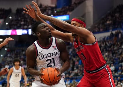 Jan 15, 2023; Hartford, Connecticut, USA; UConn Huskies forward Adama Sanogo (21) looks to shoot against St. John's Red Storm center Joel Soriano (11) in the first half at XL Center. Mandatory Credit: David Butler II-USA TODAY Sports