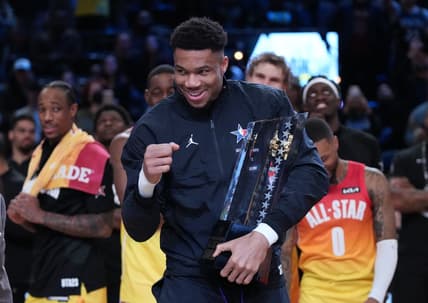Feb 19, 2023; Salt Lake City, UT, USA; Team Giannis forward Giannis Antetokounmpo (34) celebrates with the NBA All-Star Game Trophy after the 2023 NBA All-Star Game at Vivint Arena. Mandatory Credit: Kyle Terada-USA TODAY Sports