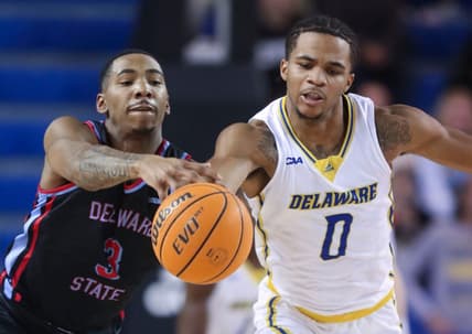 Delaware State's Martaz Robinson moves too late to stop Delaware's Jameer Nelson Jr. from getting to a loose ball in the first half of the Blue Hens' 77-69 win at the Bob Carpenter Center, Wednesday, Dec. 7, 2022.

Ncaa Basketball Wil Hens Hornets Hoops Delaware State At Delaware