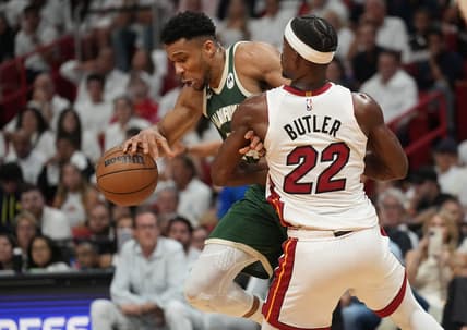 Apr 24, 2023; Miami, Florida, USA; Miami Heat forward Jimmy Butler (22) defends Milwaukee Bucks forward Giannis Antetokounmpo (34) in the first quarter during game four of the 2023 NBA Playoffs at Kaseya Center. Mandatory Credit: Jim Rassol-USA TODAY Sports