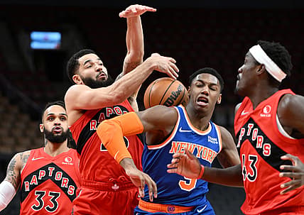 Jan 2, 2022; Toronto, Ontario, CAN;   New York Knicks guard RJ Barrett (9) has an attempted shot blocked by Toronto Raptors guard Fred VanVleet (23) in the first half at Scotiabank Arena. Mandatory Credit: Dan Hamilton-USA TODAY Sports