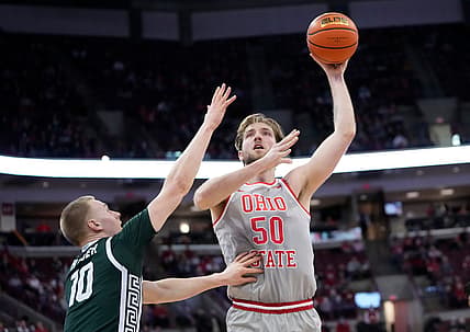 Ohio State Buckeyes center Joey Brunk (50) shoots a hook shot over Michigan State Spartans forward Joey Hauser (10) during the first half of the NCAA men's basketball game at Value City Arena in Columbus on March 3, 2022.

Michigan State Spartans At Ohio State Buckeyes