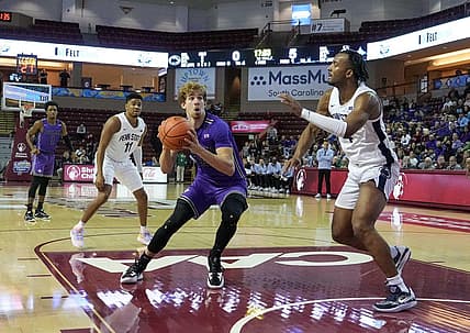 Nov 17, 2022; Charleston, South Carolina, USA; Furman Paladins guard Carter Whitt (11) sets for a shot in the first half against the Penn State Nittany Lions at TD Arena. Mandatory Credit: David Yeazell-USA TODAY Sports