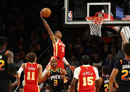 Feb 1, 2023; Phoenix, Arizona, USA; Atlanta Hawks guard Dejounte Murray (5) slam dunks the ball against the Phoenix Suns in the first half at Footprint Center. Mandatory Credit: Mark J. Rebilas-USA TODAY Sports