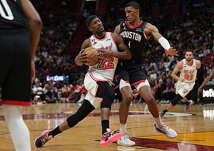 Feb 10, 2023; Miami, Florida, USA; Houston Rockets forward Jabari Smith Jr. (1) defends Miami Heat forward Jimmy Butler (22) in the first half at Miami-Dade Arena. Mandatory Credit: Jim Rassol-USA TODAY Sports
