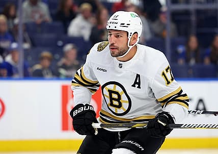Sep 26, 2023; Buffalo, New York, USA;  Boston Bruins left wing Milan Lucic (17) looks for the puck during the first period against the Buffalo Sabres at KeyBank Center. Mandatory Credit: Timothy T. Ludwig-USA TODAY Sports