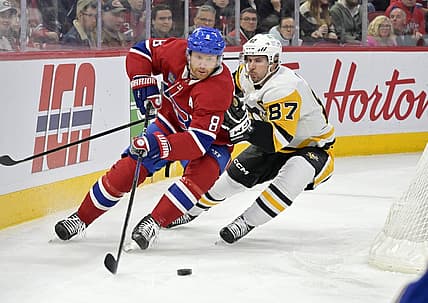 Dec 13, 2023; Montreal, Quebec, CAN; Pittsburgh Penguins forward Sidney Crosby (87) forechecks Montreal Canadiens defenseman Mike Matheson (8) during the first period at the Bell Centre. Mandatory Credit: Eric Bolte-USA TODAY Sports