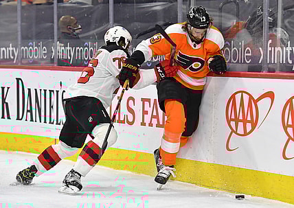 Mar 23, 2021; Philadelphia, Pennsylvania, USA; New Jersey Devils defenseman P.K. Subban (76) checks Philadelphia Flyers center Kevin Hayes (13) during the first period at Wells Fargo Center. Mandatory Credit: Eric Hartline-USA TODAY Sports