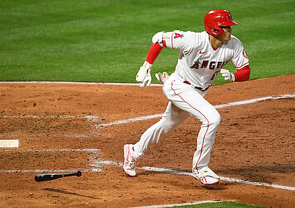 Apr 3, 2021; Anaheim, California, USA; Los Angeles Angels designated hitter Shohei Ohtani (17) runs to first base after hitting  a single against the Chicago White Sox in the fifth Inning at Angel Stadium. Mandatory Credit: Jayne Kamin-Oncea-USA TODAY Sports