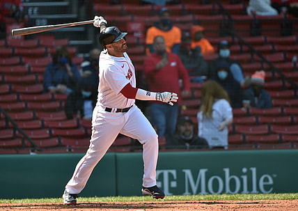 Apr 4, 2021; Boston, Massachusetts, USA;  Boston Red Sox designated hitter J.D. Martinez (28) hits a home run during the fourth inning against the Baltimore Orioles at Fenway Park. Mandatory Credit: Bob DeChiara-USA TODAY Sports