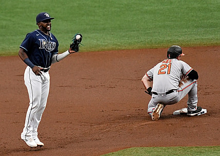Jul 21, 2021; St. Petersburg, Florida, USA; Tampa Bay Rays second baseman Vidal Brujan (left) reacts after turning a double play in the first inning against the Baltimore Orioles at Tropicana Field. Mandatory Credit: Jonathan Dyer-USA TODAY Sports