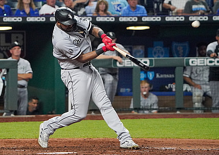 Jul 27, 2021; Kansas City, Missouri, USA; Chicago White Sox left fielder Eloy Jimenez (74) connects for a three run home run in the eighth inning against the Kansas City Royals at Kauffman Stadium. Mandatory Credit: Denny Medley-USA TODAY Sports