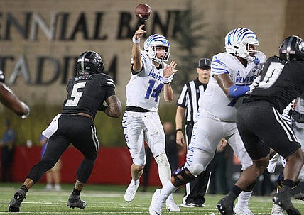 Memphis Tigers quarterback Seth Henigan throws the ball against the Arkansas State Red Wolves during their game at Centennial Bank Stadium in Jonesboro, Ark. On Sept. 11, 2021.

Jrca1930