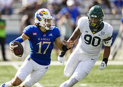 Sep 18, 2021; Lawrence, Kansas, USA; Kansas Jayhawks quarterback Jason Bean (17) scrambles from Baylor Bears defensive lineman TJ Franklin (90) during the first half at David Booth Kansas Memorial Stadium. Mandatory Credit: Jay Biggerstaff-USA TODAY Sports