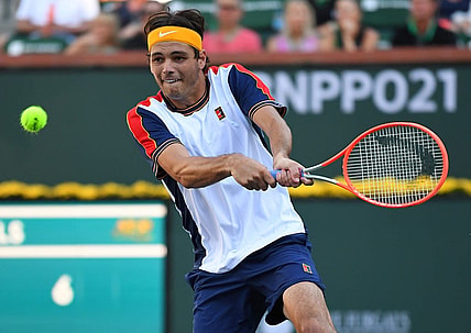 Oct 16, 2021; Indian Wells, CA, USA;  Taylor Fritz (USA) hits a shot in his semifinal match against Nikoloz Basilashvili (GEO) at the BNP Paribas Open at the Indian Wells Tennis Garden. Mandatory Credit: Jayne Kamin-Oncea-USA TODAY Sports