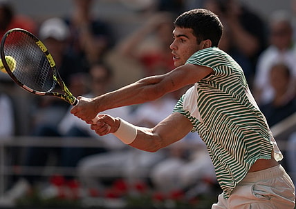 Jun 9 2023; Paris,France; Carlos Alcaraz (ESP) returns a shot during his semifinal match against Novak Djokovic (SRB) on day 13 at Stade Roland-Garros. Mandatory Credit: Susan Mullane-USA TODAY Sports