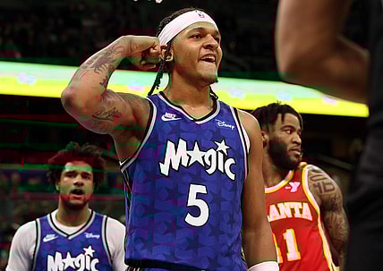 Jan 7, 2024; Orlando, Florida, USA; Orlando Magic forward Paolo Banchero (5) celebrates after he made  basket  against the Atlanta Hawks during overtime at Kia Center. Mandatory Credit: Kim Klement Neitzel-USA TODAY Sports