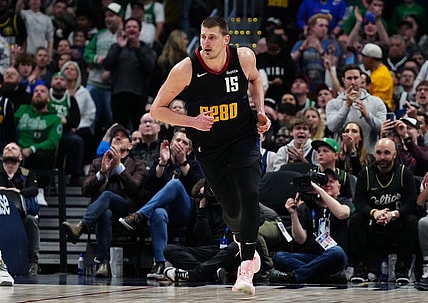 Mar 7, 2024; Denver, Colorado, USA; Denver Nuggets center Nikola Jokic (15) following his score in the second half against the Boston Celtics at Ball Arena. Mandatory Credit: Ron Chenoy-USA TODAY Sports