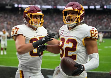 Dec 5, 2021; Paradise, Nevada, USA; Washington Football Team tight end Logan Thomas (82) celebrates with Washington Football Team tight end John Bates (87) after scoring a touchdown against the Las Vegas Raiders during the first quarter at Allegiant Stadium. Mandatory Credit: Stephen R. Sylvanie-USA TODAY Sports