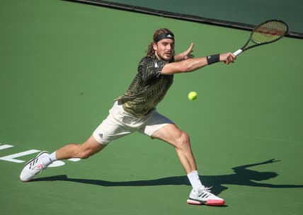 Stefanos Tsitsipas hits a shot against Nikoloz Basilashvili during their quarterfinal match at the BNP Paribas Open in Indian Wells, October 15, 2021.

Bnp Friday 27