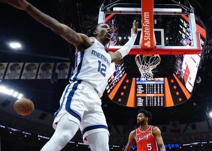 Feb 26, 2022; Chicago, Illinois, USA; Memphis Grizzlies guard Ja Morant (12) reacts after scoring against the Chicago Bulls during the second half at United Center. Mandatory Credit: David Banks-USA TODAY Sports