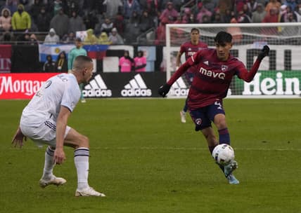 Apr 2, 2022; Chicago, Illinois, USA; FC Dallas defender Marco Farfan (4) makes a pass on Chicago Fire defender Boris Sekulic (2) during the first half at Soldier Field. Mandatory Credit: Mike Dinovo-USA TODAY Sports