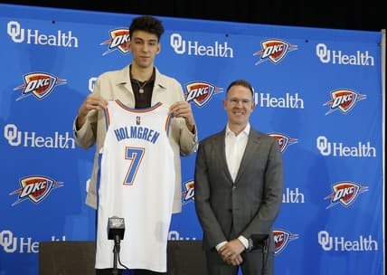 Jun 25, 2022; Oklahoma City, OK, USA; Oklahoma City Thunder forward Chet Holmgren poses with his jersey and general manager Sam Presti following an introductory press conference at Clara Luper Center. Mandatory Credit: Alonzo Adams-USA TODAY Sports