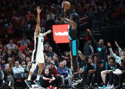 Nov 15, 2022; Portland, Oregon, USA; Portland Trail Blazers forward Jerami Grant (9) shoots the ball in a game against the San Antonio Spurs in the first half at Moda Center. Mandatory Credit: Jaime Valdez-USA TODAY Sports