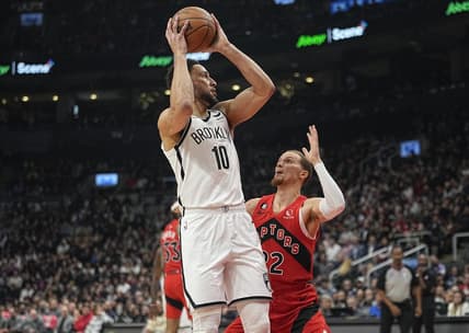 Nov 23, 2022; Toronto, Ontario, CAN; Brooklyn Nets guard Ben Simmons (10) goes to pass the ball as Toronto Raptors guard Malachi Flynn (22) defends during the first quarter at Scotiabank Arena. Mandatory Credit: John E. Sokolowski-USA TODAY Sports