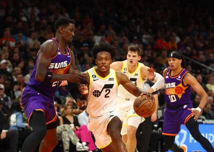 Nov 26, 2022; Phoenix, Arizona, USA; Utah Jazz guard Collin Sexton (2) drives to the basket against Phoenix Suns center Deandre Ayton (22) in the first half at Footprint Center. Mandatory Credit: Mark J. Rebilas-USA TODAY Sports