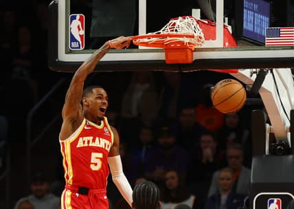 Feb 1, 2023; Phoenix, Arizona, USA; Atlanta Hawks guard Dejounte Murray (5) slam dunks the ball against the Phoenix Suns in the first half at Footprint Center. Mandatory Credit: Mark J. Rebilas-USA TODAY Sports