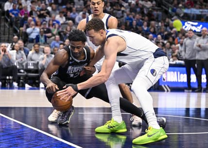 Mar 13, 2023; Dallas, Texas, USA; Memphis Grizzlies forward Jaren Jackson Jr. (13) and Dallas Mavericks center Dwight Powell (7) battle for control of the loose ball during the second quarter at the American Airlines Center. Mandatory Credit: Jerome Miron-USA TODAY Sports