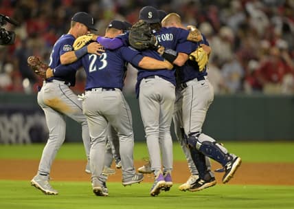 Aug 4, 2023; Anaheim, California, USA;  Seattle Mariners players dance in a circle after defeating the Los Angeles Angels at Angel Stadium. Mandatory Credit: Jayne Kamin-Oncea-USA TODAY Sports