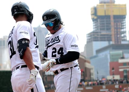 Detroit Tigers Miguel Cabrera shakes hands with teammate Riley Greene after scoring the Tigers first run during game action on Fiesta Tigres between the Detroit Tigers and the Tampa Bay Rays at Comerica Park in Detroit on Saturday, August 5, 2023.