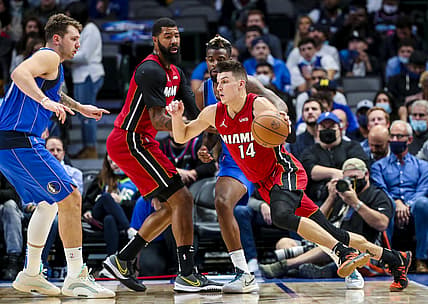 Nov 2, 2021; Dallas, Texas, USA; Miami Heat guard Tyler Herro (14) drives to the basket as Dallas Mavericks guard Luka Doncic (77) defends during the second quarter at American Airlines Center. Mandatory Credit: Kevin Jairaj-USA TODAY Sports