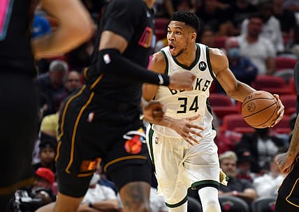 Dec 8, 2021; Miami, Florida, USA; Milwaukee Bucks forward Giannis Antetokounmpo (34) looks to pass the ball in the first half against the Miami Heat at FTX Arena. Mandatory Credit: Jim Rassol-USA TODAY Sports