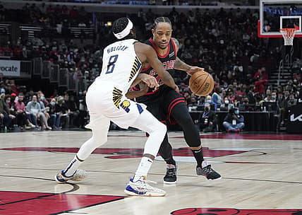 Dec 26, 2021; Chicago, Illinois, USA; Indiana Pacers forward Justin Holiday (8) defends Chicago Bulls forward DeMar DeRozan (11) during the first half at United Center. Mandatory Credit: David Banks-USA TODAY Sports