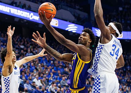 Feb 23, 2022; Lexington, Kentucky, USA; LSU Tigers forward Tari Eason (13) goes to the basket during the first half against the Kentucky Wildcats at Rupp Arena at Central Bank Center. Mandatory Credit: Jordan Prather-USA TODAY Sports