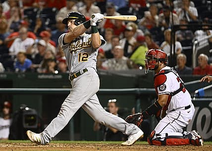 Aug 30, 2022; Washington, District of Columbia, USA; Oakland Athletics catcher Sean Murphy (12) hits a grand slam against the Washington Nationals during the fifth inning at Nationals Park. Mandatory Credit: Brad Mills-USA TODAY Sports