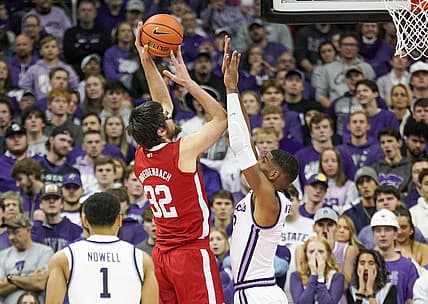 Dec 17, 2022; Kansas City, Missouri, USA; Nebraska Cornhuskers forward Wilhelm Breidenbach (32) shoots over Kansas State Wildcats forward David N'Guessan (3) during the first half at T-Mobile Center. Mandatory Credit: Denny Medley-USA TODAY Sports