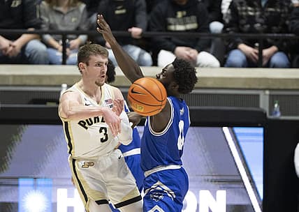 Dec 21, 2022; West Lafayette, Indiana, USA; Purdue Boilermakers guard Braden Smith (3) passes the ball around New Orleans Privateers guard Daniel Sackey (0) during the first half at Mackey Arena. Mandatory Credit: Marc Lebryk-USA TODAY Sports